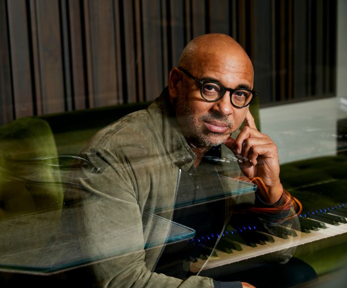 Portrait of Harvey Mason Jr. sitting at a keyboard.