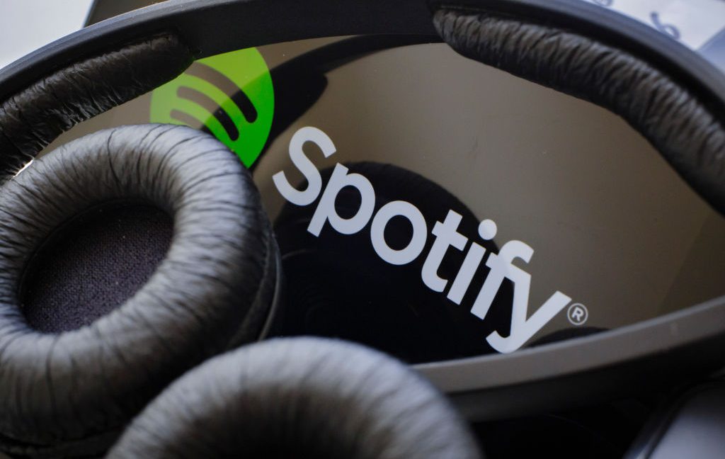 Spotify on a phone with headphones
