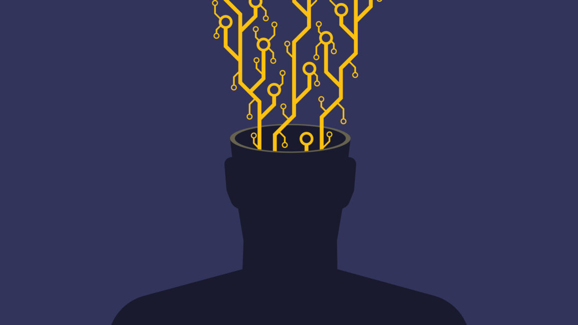 An image of a faceless human silhouette (chest up) with exposed microchip contacts and circuitry erupting from its open head. This visual metaphor explores transhumanism, AI integration, or the erosion of organic thought in the digital age. The stark contrast between the biological silhouette and mechanical components highlights themes of technological dependence or posthuman evolution. Ideal for articles on neural implants, futurism, or the ethics of human augmentation.